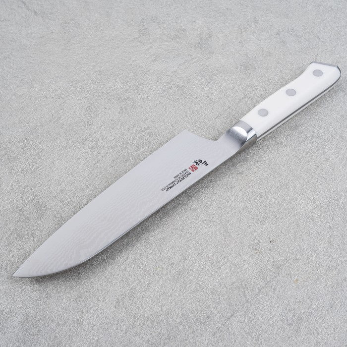 MCUSTA Corian Series VG10 33-Damascus Santoku 180mm